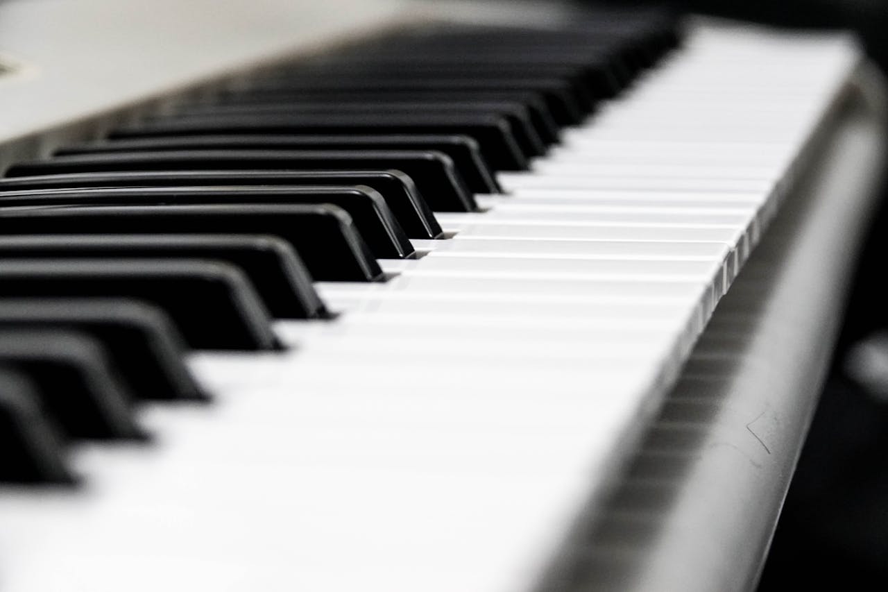Close-up of piano keys used in music therapy to support emotional healing