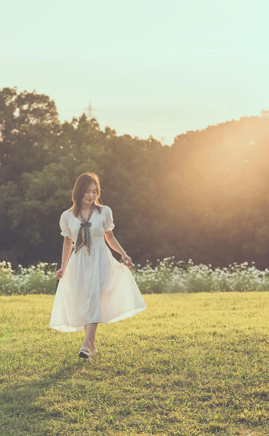 Image 4: Asian girl in white dress standing in sunlit garden with white flowers, gentle light and serene mood evoking peace ok