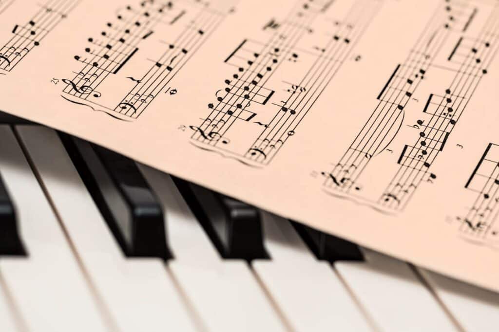 Sheet music resting on piano keys representing music therapy for ADHD focus and attention support
