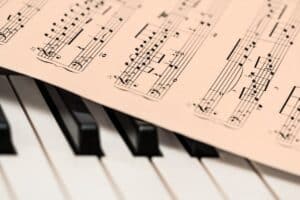 Sheet music resting on piano keys representing music therapy for ADHD focus and attention support