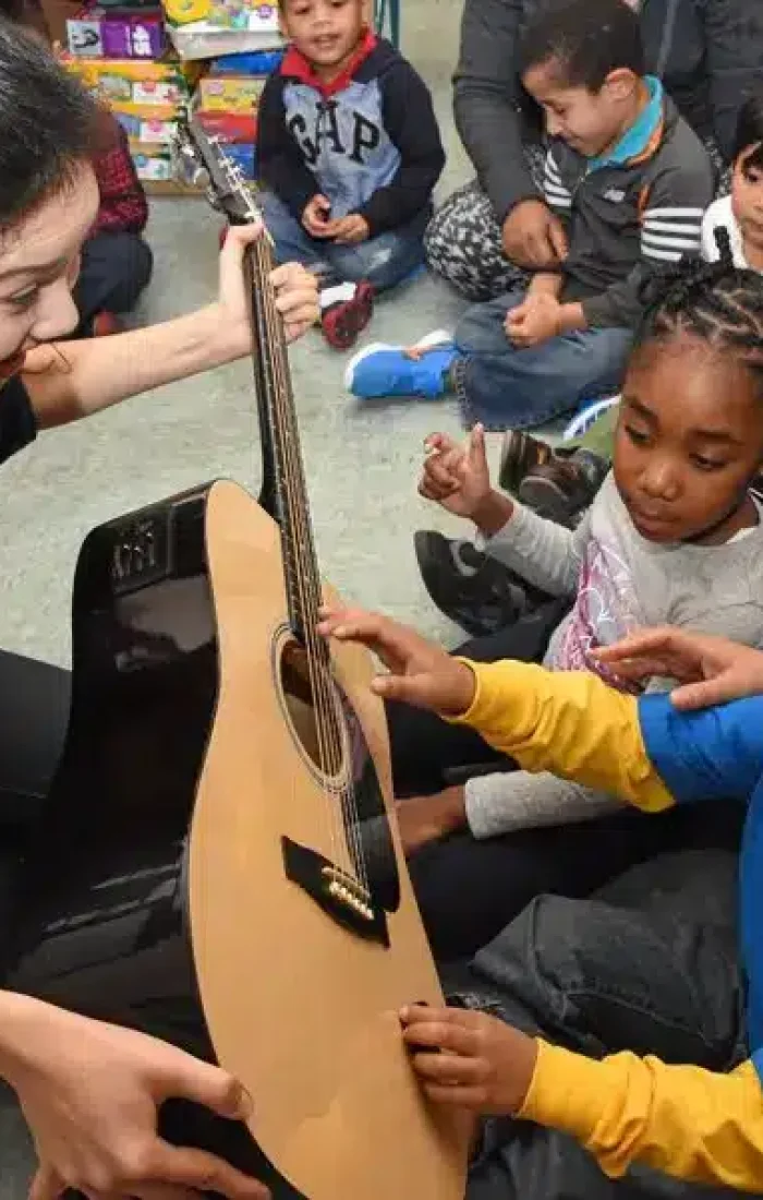 Group therapy near me, neurodivergent children exploring music therapy for social skills in the University Hill sensory-friendly space